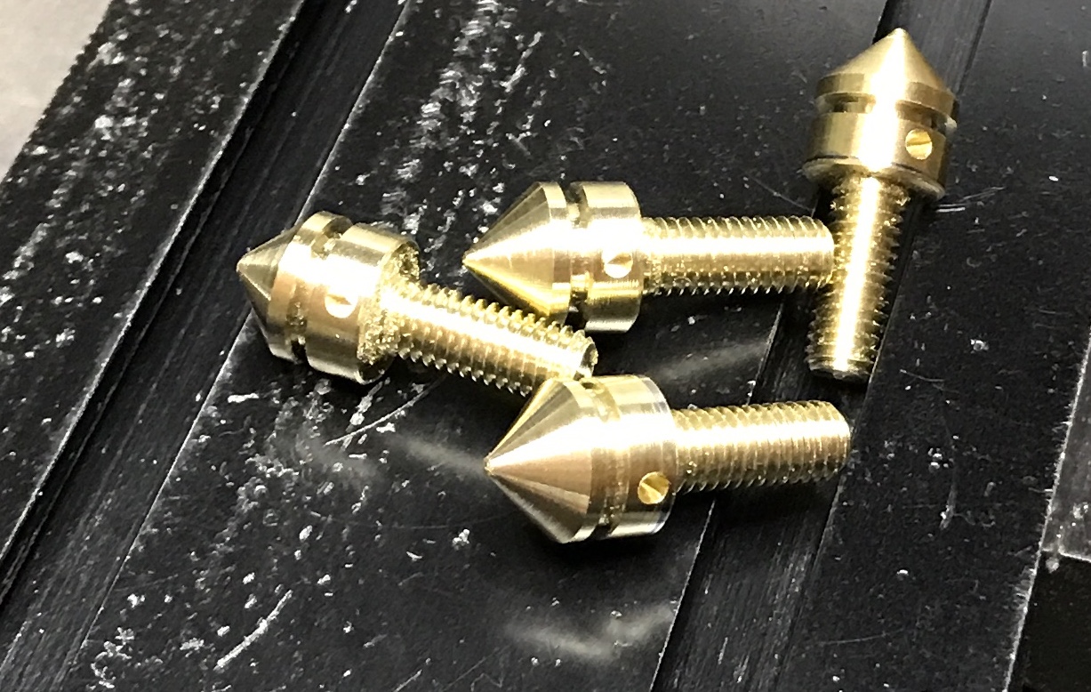 Four completed cap screws